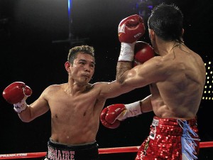 Philippine boxer Nonito Donaire connects with a left to Omar Narvaez of Argentina in the WBC, WBO World Bantamweight Titles bout at Madison Square Garden in New York on October 22, 2011. CHRIS TROTMAN/AFP