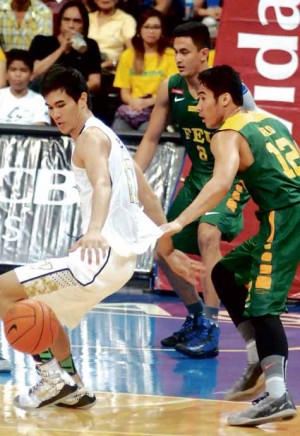 NATIONALUstalwart Troy Rosario loses possession as FEU starMac Belo holds on to his jersey in this low-post play in Game 1. ARNOLD ALMACEN