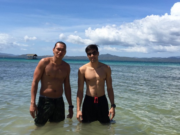 Reynel Hugnatan and Rey Guevarra go swimming at Dos Palmas Island Resort.  Mark Giongco/INQUIRER.net