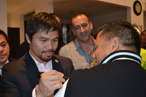 Manny Pacquiao autographs the spot where he punched Cerritos Mayor Mark Pulido. Photo courtesy of Gloria Perlas Pulido