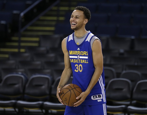 Golden State Warriors' Stephen Curry smiles during NBA basketball practice, Wednesday, June 3, 2015, in Oakland, Calif. The Warriors host the Cleveland Cavaliers in Game 1 of the NBA Finals on Thursday. (AP Photo/Ben Margot)