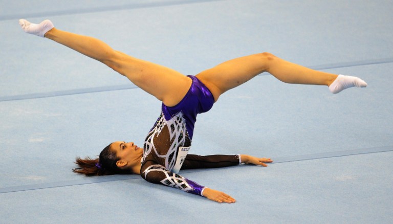 Farah Ann Abdul Hadi of Malaysia competes during the women s floor excercise routine final at the 28th Southeast Asian Games (SEA Games) in Singapore on June 10, 2015. AFP PHOTO 