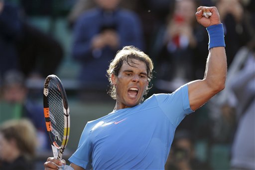 Spain's Rafael Nadal celebrates winning the fourth round match of the French Open tennis tournament against Jack Sock of the U.S. in four sets 6-3, 6-1, 5-7, 6-2, at the Roland Garros stadium, in Paris, France, Monday, June 1, 2015. 