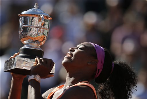Serena Williams of the U.S holds the cup after defeating Lucie Safarova of the Czech Republic  during their final match of the French Open tennis tournament at the Roland Garros stadium,  Saturday, June 6, 2015 in Paris. Williams won 6-3, 6-7, 6-2.  (AP Photo/Francois Mori)