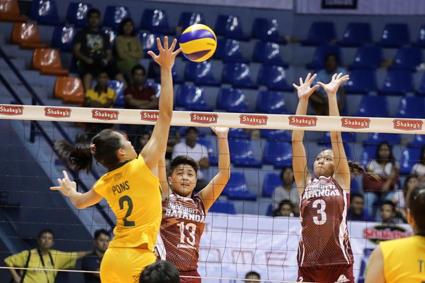 Bernadette Pons puts a shot against University of Batangas defenders.