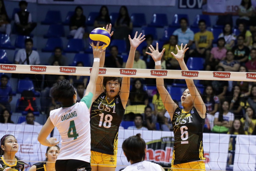 Ria Meneses (18) and Pam Lastimosa of UST try to block the hit of La Salle Dasma's Desiree Dadang. TRISTAN TAMAYO/INQUIRER.net