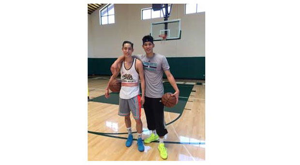 Taiwanese-American National Basketball Association (NBA) player Jeremy Lin, right, and his younger brother Joseph Lin pose for photograph at a basketball court in this undated photograph.