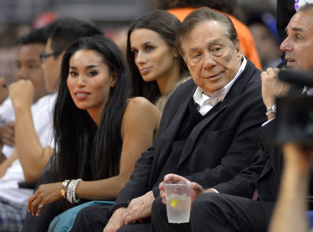  In this Oct. 25, 2013, file photo, then-Los Angeles Clippers owner Donald Sterling, right, and V. Stiviano, left, watch the Clippers play the Sacramento Kings during an NBA basketball game in Los Angeles. Former Clippers owner Sterling has filed for divorce from his wife of nearly 60 years on Wednesday, Aug. 5, 2015, as he continues to battle her over ownership of the team. Sterling, 81, cited irreconcilable differences in paperwork submitted to the Los Angeles Superior Court, attorney Bobby Samini said. The filing comes two weeks before the couple's 60th anniversary and about four months after a judge ordered Stiviano, a woman who Shelly Sterling alleged was her husband's mistress, to turn over the keys to a $1.8 million house that Donald Sterling bought her and to pay Shelly Sterling about $800,000 that her husband showered on the younger woman in cash, a Ferrari and other luxury vehicles. (AP Photo/Mark J. Terrill, File)
