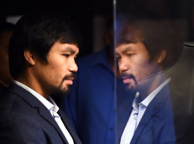 Boxer Manny Pacquiao tours the Asia Society in New York on October 12, 2015. Pacquiao, who announced on October 5 that he will be running for senator in the 2016 Philippine general elections, is in town to receive Asia Society's 2015 Asia Game Changer of the Year Award, which recognizes those making a transformative and positive difference for the future of Asia and the world.    AFP PHOTO / TIMOTHY A. CLARY