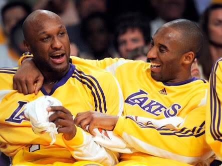 In this Nov. 18, 2008, file photo, Los Angeles Lakers guard Kobe Bryant, right, talks with forward Lamar Odom after Odom fouled out against the Chicago Bulls during the second half of their NBA basketball game in Los Angeles. Odom, who was embraced by teammates and television fans alike for his Everyman approach to fame, was found face-down and alone Tuesday, Oct. 13, 2015, after spending four days at the Love Ranch, a legal Nevada brothel. Kobe Bryant joined Khloe Kardashian and some of Odom's childhood friends at his bedside after a Tuesday night Lakers game in Las Vegas. AP