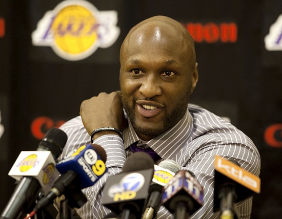 FILE - In this July 31, 2009, file photo, Los Angeles Lakers' Lamar Odom speaks to the media during a news conference after the Lakers signed Odom to a multi-year NBA basketball contract, in El Segundo, Calif. Odom spent most of his 14-year NBA career in Los Angeles with the Lakers and Clippers, becoming a fan favorite before he sought even more fame with the Kardashians. Odom, who was embraced by teammates and television fans alike for his Everyman approach to fame, was found face-down and alone Tuesday, Oct. 13, 2015,  after spending four days at the Love Ranch, a legal Nevada brothel. (AP Photo/Jeff Lewis, File)