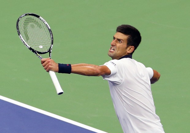 FILE—Novak Djokovic, of Serbia, reacts after winning a game in the fourth set during his fourth round match against Roberto Bautista Agut, of Spain, at the U.S. Open tennis tournament in New York, Sunday, Sept. 6, 2015. Djokovic won 6-3, 4-6, 6-4, 6-3. (AP Photo/Adam Hunger)