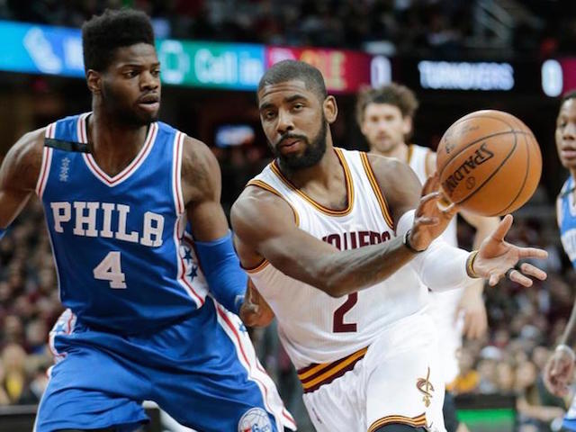 Cleveland Cavaliers' Kyrie Irving (2) passes around Philadelphia 76ers’ Nerlens Noel (4) in the first half of an NBA basketball game Sunday, Dec. 20, 2015, in Cleveland. The Cavaliers won 108-86. AP