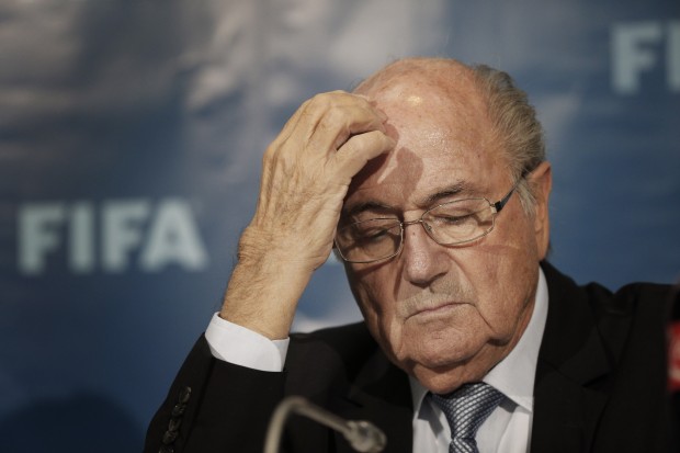 FILE - In this Dec. 19, 2014 file photo FIFA President Sepp Blatter gestures as he attends a news conference in Marrakech, Morocco. The FBI is investigating Blatter's role in a kickbacks scandal that involved his predecessor as FIFA president, Joao Havelange, the BBC reported Sunday, Dec. 6, 2015. (AP Photo/Christophe Ena, File)