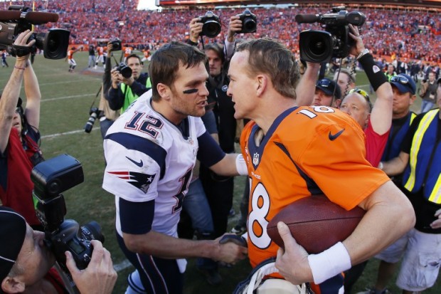FILE ---Tom Brady #12 of the New England Patriots congratulates Peyton Manning #18 of the Denver Broncos after the Broncos defeated the Patriots 26 to 16 during the AFC Championship game at Sports Authority Field at Mile High on January 19, 2014 in Denver, Colorado.   Kevin C. Cox/Getty Images/AFP