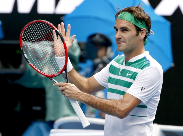 Roger Federer of Switzerland celebrates after defeating Alexandr Dolgopolov of Ukraine in their second round match at the Australian Open tennis championships in Melbourne, Australia, Wednesday, Jan. 20, 2016.(AP Photo/Vincent Thian)
