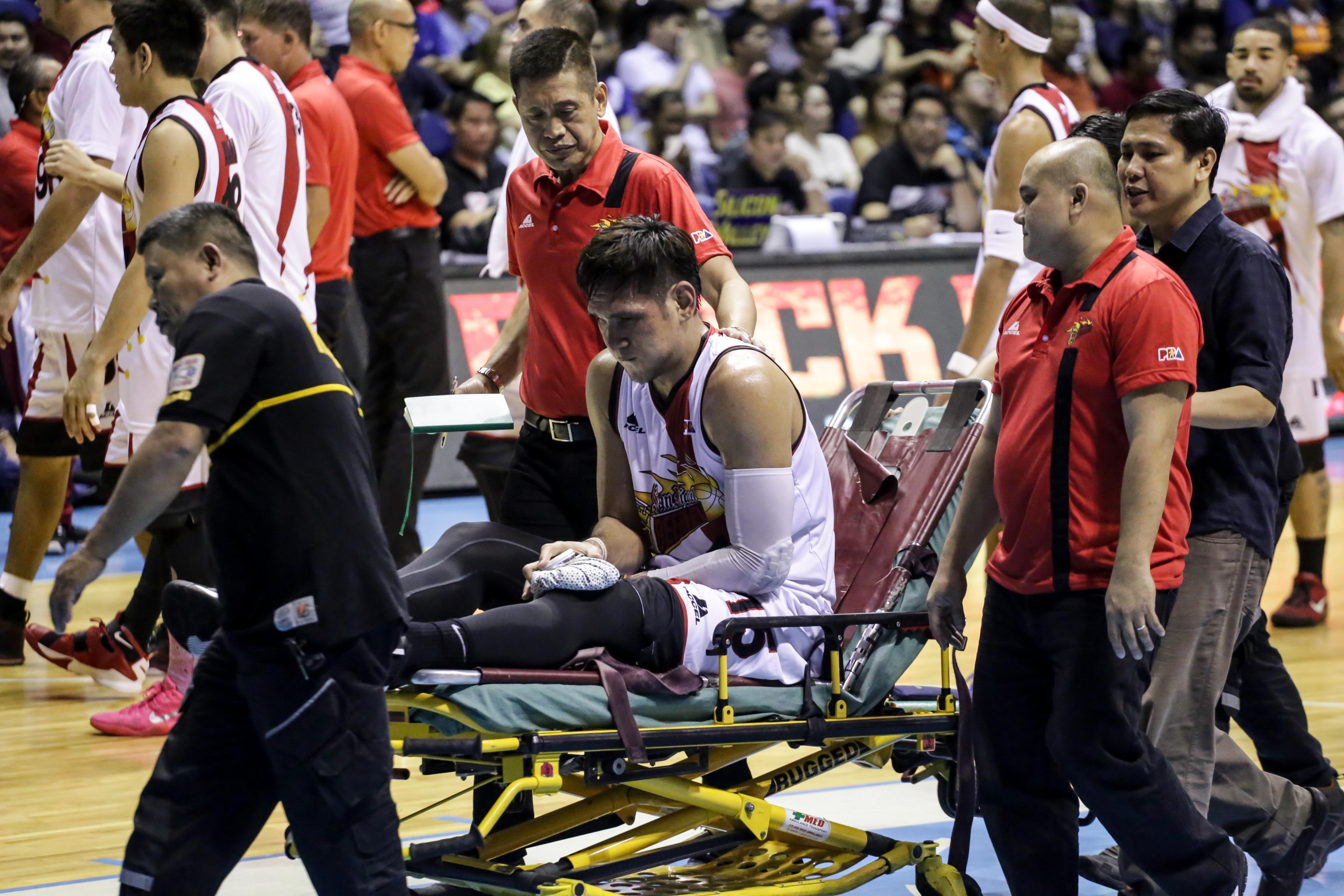 June Mar Fajardo in a stretcher after getting injured off an inbound play vs Jireh Ibañes. Photo by Tristan Tamayo/INQUIRER.net