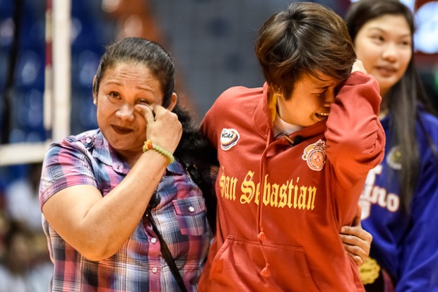 Gretchel Soltones and his mother in a tearful reunion during the NCAA volleyball awarding ceremonies Tuesday. CONTRIBUTED PHOTO