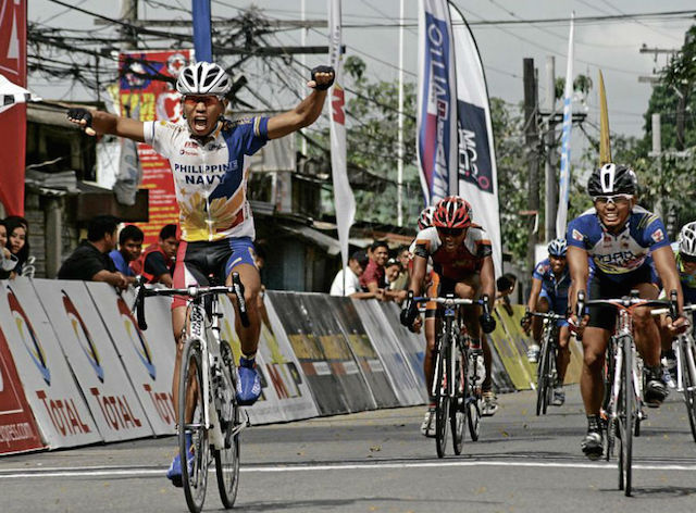 FILE - Track specialist Jan Paul Morales of Philippine Navy celebrates as he rules Stage 12 in which everyone, it seems, arrived within 20 seconds of the lead peloton except overall leader Ronald Oranza of PLDT/Spyder. CONTRIBUTED PHOTO / WILFRED LADANGA