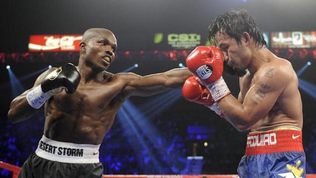 FILE - In this June 9, 2012, file photo, Timothy Bradley, left, from Palm Springs, Calif., lands a punch against Manny Pacquiao, from the Philippines, during their WBO world welterweight title fight in Las Vegas. Nearly two years after Bradley won in a disputed split decision, promoters announced Saturday, Jan. 25, 2014, that the two will fight again on April 12. AP
