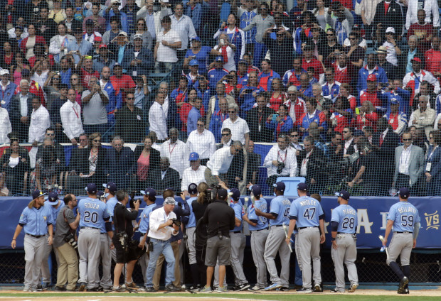 President Obama greets Tampa Bay Rays players before a match with the Cuban national team in Havana, Cuba, Tuesday March 22, 2016. The crowd roared as U.S. President Barack Obama and Cuban President Raul Castro entered the stadium and walked toward their seats in the VIP section behind home plate. It's the first game featuring an MLB team in Cuba since the Baltimore Orioles played in the country in 1999. (AP Photo/Ramon Espinosa)