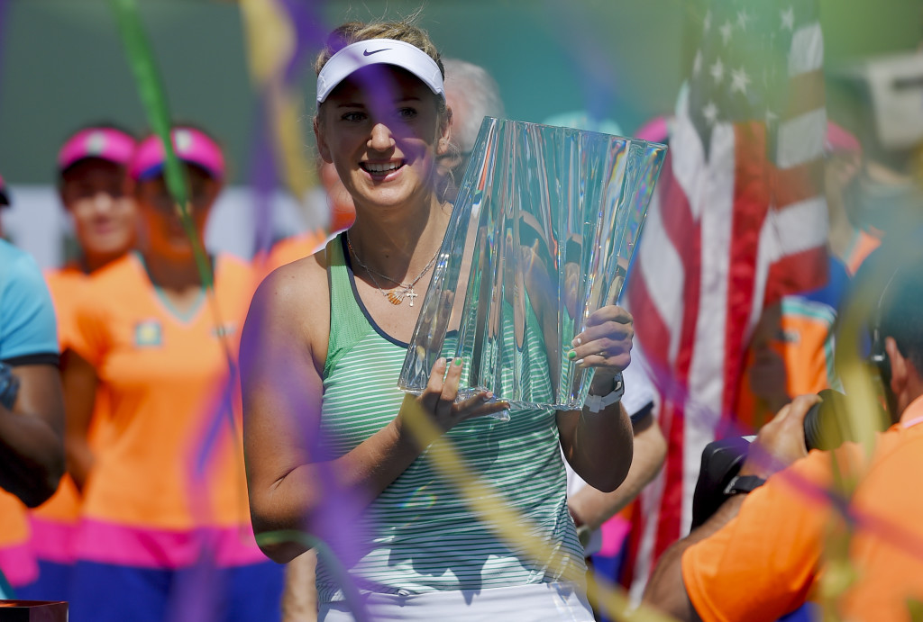 Victoria Azarenka, of Belarus, holds the trophy after defeating Serena Williams in a finals match at the BNP Paribas Open tennis tournament, Sunday, March 20, 2016, in Indian Wells, Calif. Azarenka won, 6-4, 6-4. (AP Photo/Mark J. Terrill)