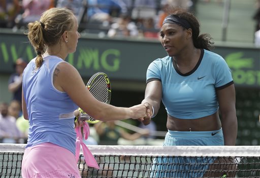 Serena Williams, right, shakes hands with Svetlana Kuznetsova, of Russia, left, after their match at the Miami Open tennis tournament, Monday, March 28, 2016, in Key Biscayne, Fla. Kuznetsova won 6-7 (3), 6-1, 6-2. AP PHOTO
