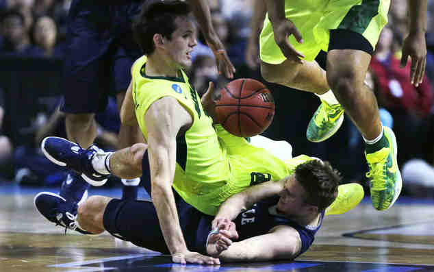 Yale guard Makai Mason (11) hits the floor while chasing the ball as Baylor guard Jake Lindsey (3) falls on him in the second half during the first round of the NCAA college men's basketball tournament in Providence, R.I., Thursday, March 17, 2016. AP