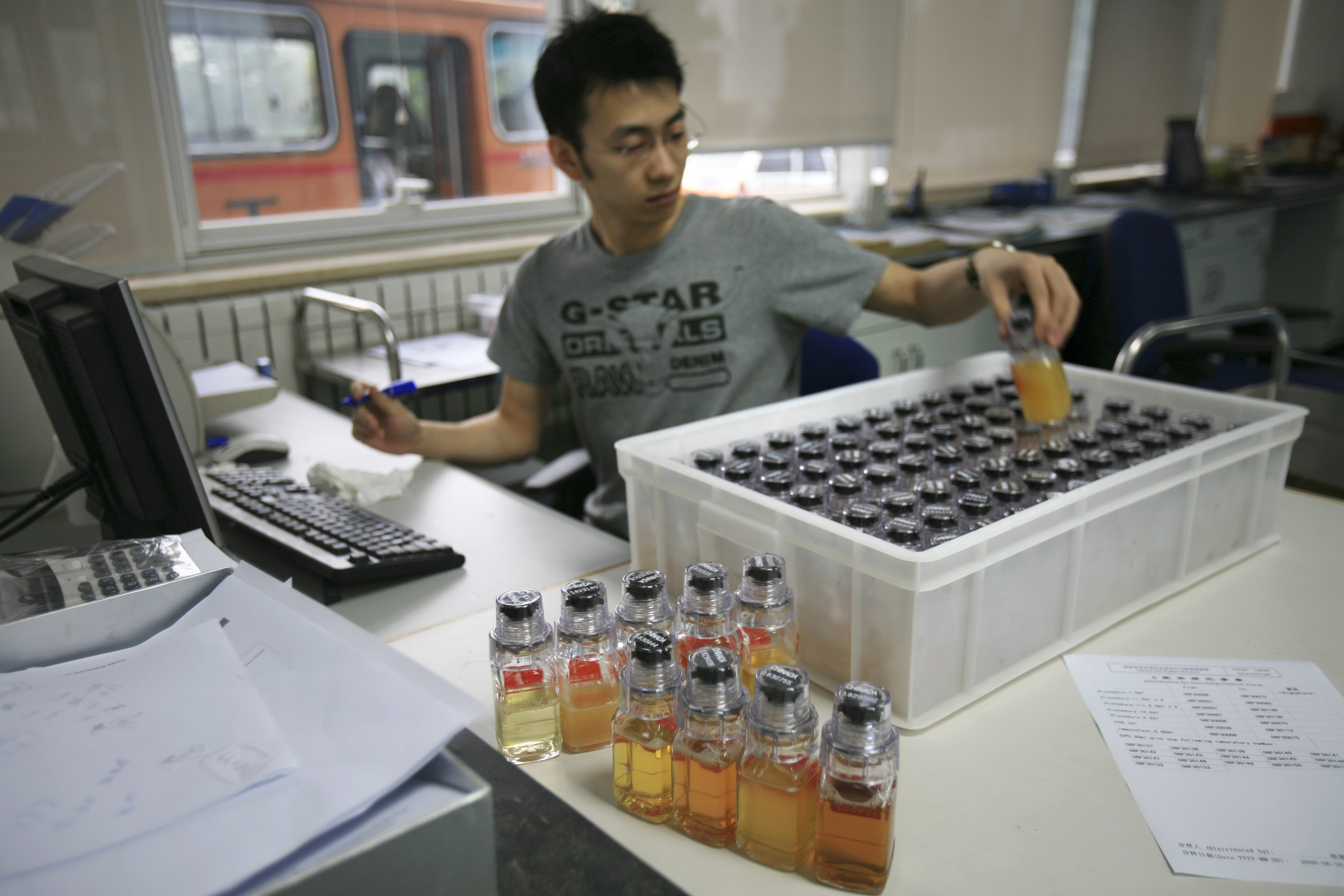 In this Monday, June 30, 2008 file photo, urine samples from Chinese athletes are recorded upon arriving at China Anti-Doping Agency in Beijing. AP File photo