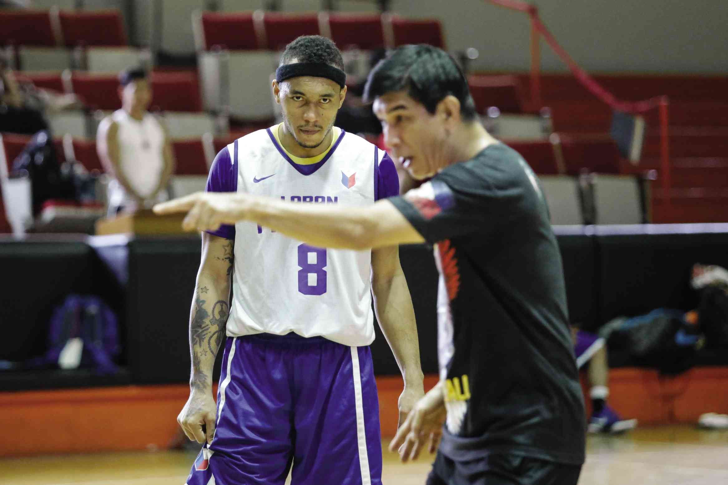 CALVIN Abueva listens intently as Gilas Pilipinas assistant coach Jong Uichico explains a play during practice. TRISTAN TAMAYO/INQUIRER.NET 