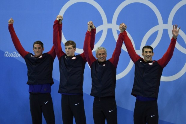 (FromL) USA's Conor Dwyer, USA's Townley Haas, USA's Ryan Lochte and USA's Michael Phelps pose on the podium after they won the Men's 4x200m Freestyle Relay Final during the swimming event at the Rio 2016 Olympic Games at the Olympic Aquatics Stadium in Rio de Janeiro on August 9, 2016.   / AFP PHOTO / CHRISTOPHE SIMON