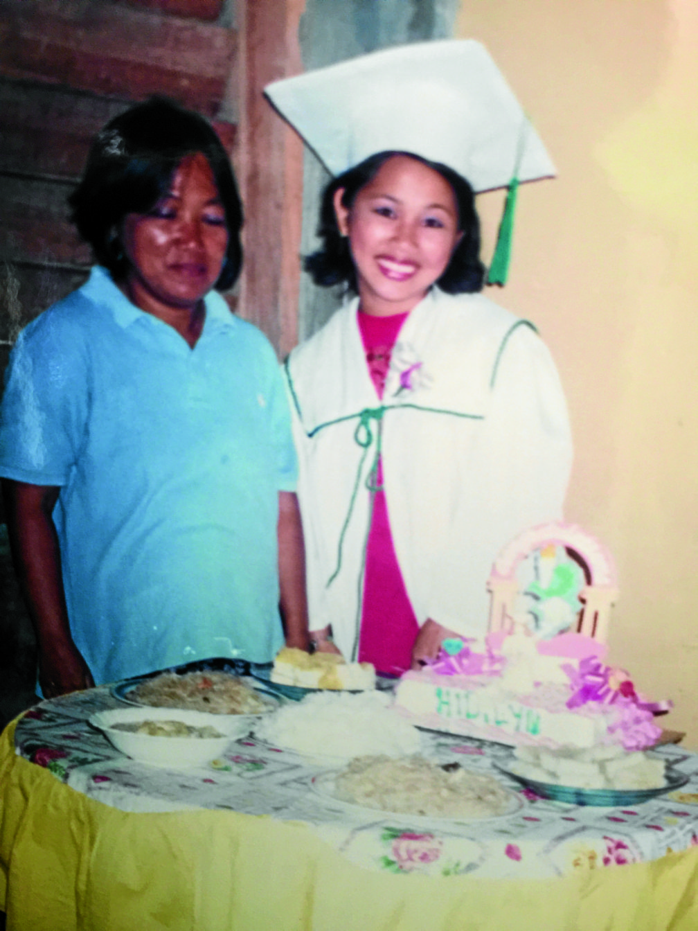 Despite family's hardships, Diazes make sure to have something simple but special for Hidilyn Diaz for every special occasion like birthday or graduation. Here Diaz, together with her mother Emelita, celebrated her highschool graduation from Universidad de Zamboanga Technical School. In her younger days, Hidilyn Diaz already tried bigger weights beyond her weight. REPRODUCTION PHOTO BY JULIE ALIPALA