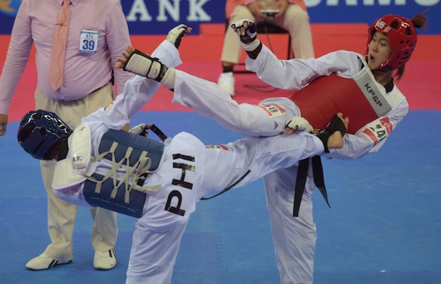 Cambodia's Seavmey Sorn (R) competes against Kirstie Elaine Alora of the Philippines (L) during their women's -73kg semi-final taekwondo bout at Ganghwa Dolmens Gymnasium during the 17th Asian Games in Incheon on October 3, 2014. AFP