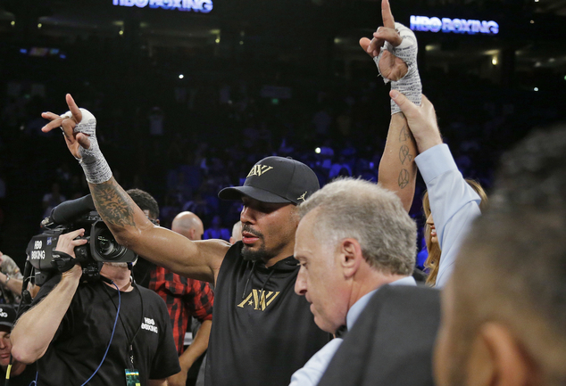 Andre Ward raises his arms at the end of his light heavyweight boxing match against Alexander Brand on Saturday, Aug. 6, 2016, in Oakland, Calif. Ward won the fight in a unanimous decision. Looking on is referee Jack Reiss. AP