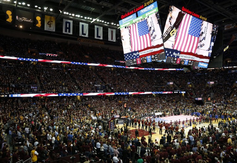 Fans sing the American national anthem at Quicken Loans Arena before the start of Game 3 of the NBA Finals between the Cleveland Cavaliers and the Golden State Warriors in Cleveland, Ohio on June 8, 2016. AFP File photo
