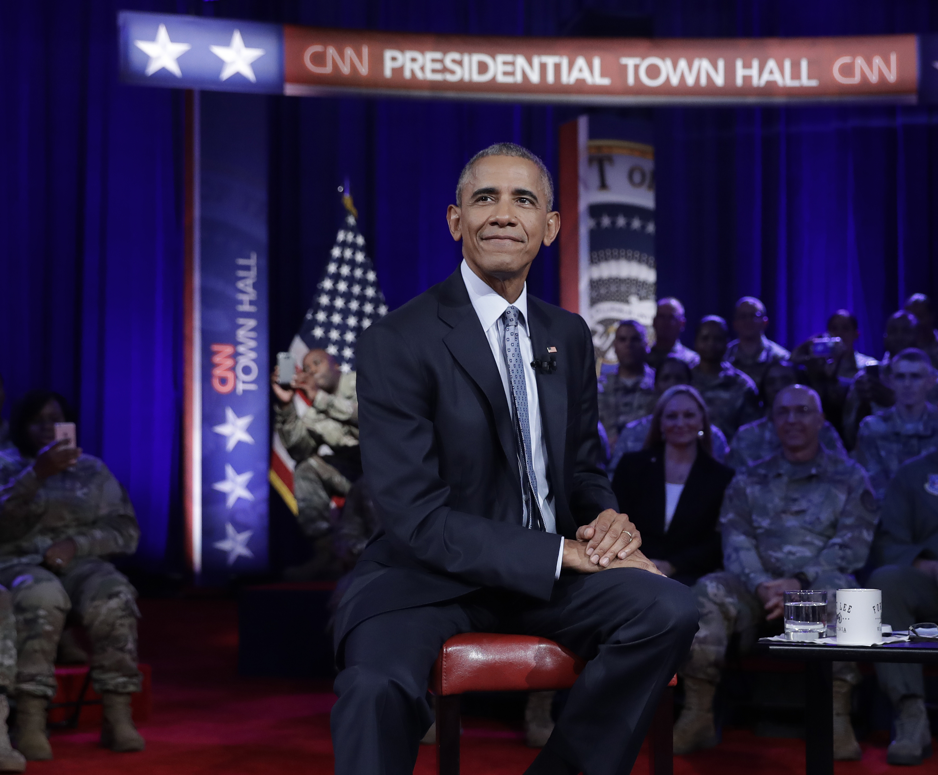 President Barack Obama pauses during a break in taping of a CNN town hall meeting with CNN news anchor Jake Tapper, Wednesday, Sept. 28, 2016, in Fort Lee, Va., with members of the military community. (AP Photo/Carolyn Kaster)