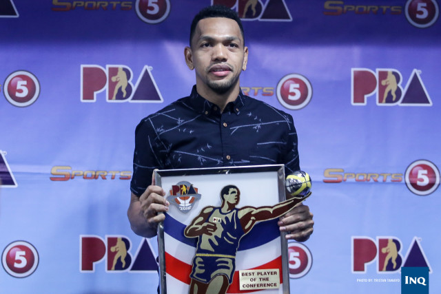 Jayson Castro holds his Best Player of the Conference award. Tristan Tamayo/INQUIRER.net