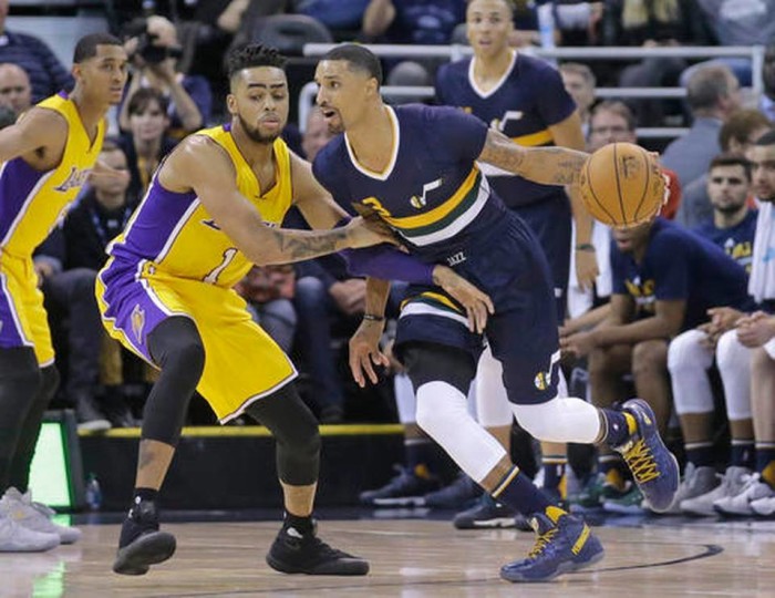 Los Angeles Lakers guard D'Angelo Russell (1) guards Utah Jazz guard George Hill (3) during the second quarter of an NBA basketball game Friday, Oct. 28, 2016, in Salt Lake City. AP