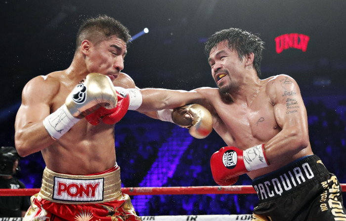 Manny Pacquiao, right, of the Philippines, hits Jessie Vargas during their WBO welterweight title boxing match, Saturday, Nov. 5, 2016, in Las Vegas. (AP Photo/Isaac Brekken)