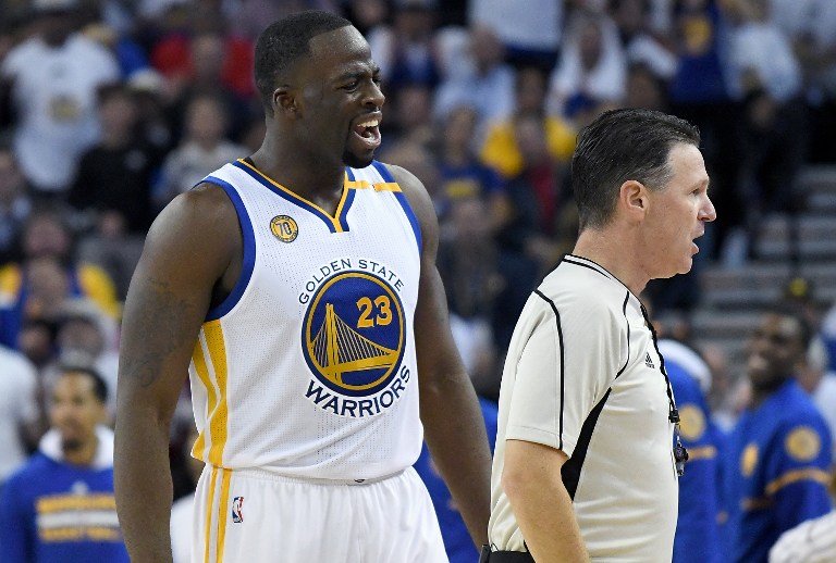OAKLAND, CA - OCTOBER 25: Draymond Green #23 of the Golden State Warriors complains to official Pat Fraher #26 after Fraher called a technical foul on Green against the San Antonio Spurs during the third quarter in an NBA basketball game at ORACLE Arena on October 25, 2016 Oakland, California. Thearon W. Henderson/Getty Images/AFP