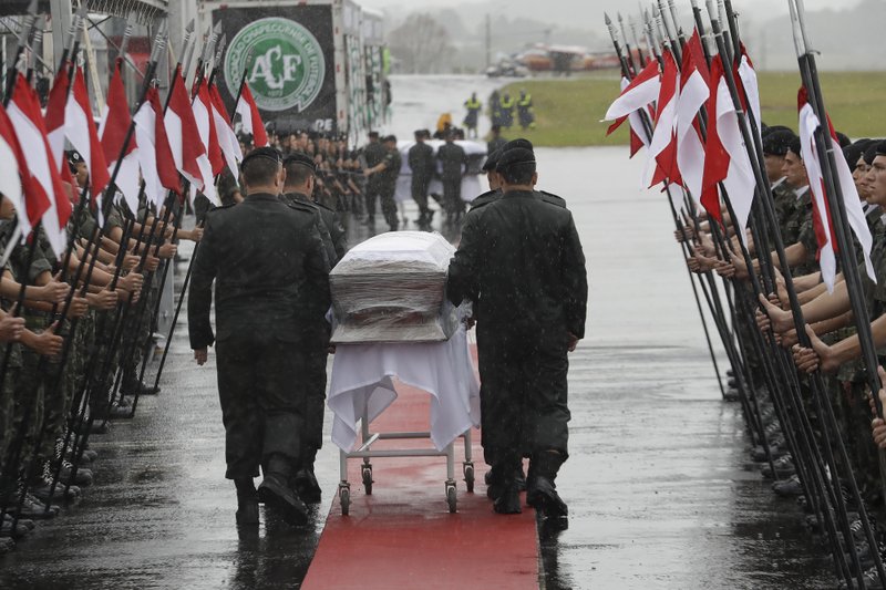 The caskets with the remains of Chapecoense soccer team victims, arrive in Chapeco, Brazil, Saturday, Dec. 3, 2016. AP