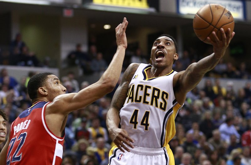 Indiana Pacers guard Jeff Teague (44)shoots the basketball defended by Washington Wizards forward Otto Porter Jr. in the second half of an NBA basketball game, Monday, Dec. 19, 2016, in Indianapolis. Indiana won 107-105. AP