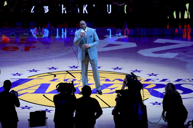 Earvin 'Magic' Johnson addresses the crowd as he pays tribute to Kobe Bryant #24 of the Los Angeles Lakers before Bryant plays his final NBA game at Staples Center on April 13, 2016 in Los Angeles, California. NOTE TO USER: User expressly acknowledges and agrees that, by downloading and or using this photograph, User is consenting to the terms and conditions of the Getty Images License Agreement.   Sean M. Haffey/Getty Images/AFP