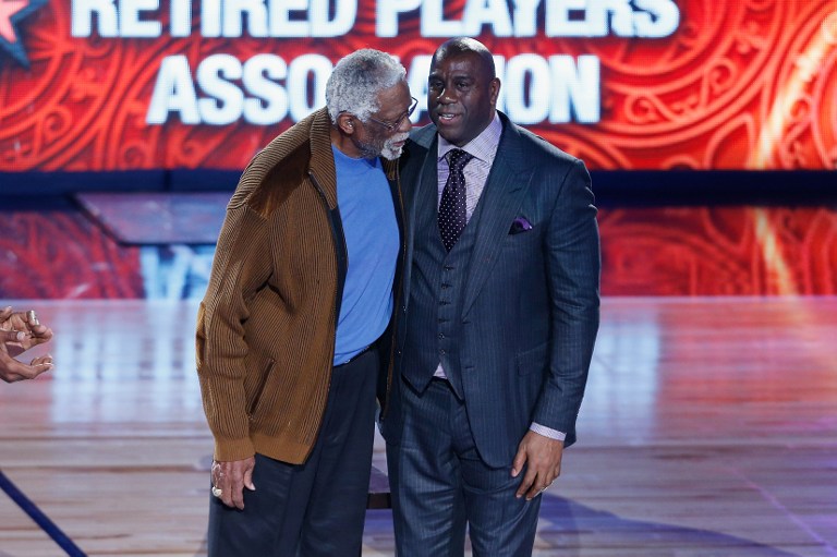 Former NBA players Bill Russell (L) and Earvin "Magic" Johnson Jr. are honored during the 2017 NBA All-Star Game at Smoothie King Center on February 19, 2017 in New Orleans, Louisiana. Jonathan Bachman/Getty Images/AFP