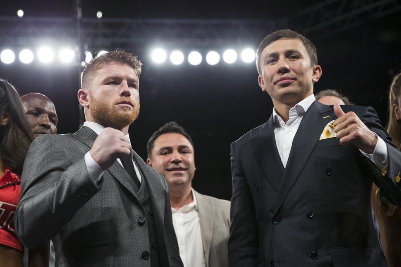 Saul “Canelo” Alvarez, left, and Gennady Golovkin pose on Saturday, May 6, 2017, in Las Vegas. The two boxing fighters will fight Sept. 16. (Erik Verduzco/Las Vegas Review-Journal via AP)