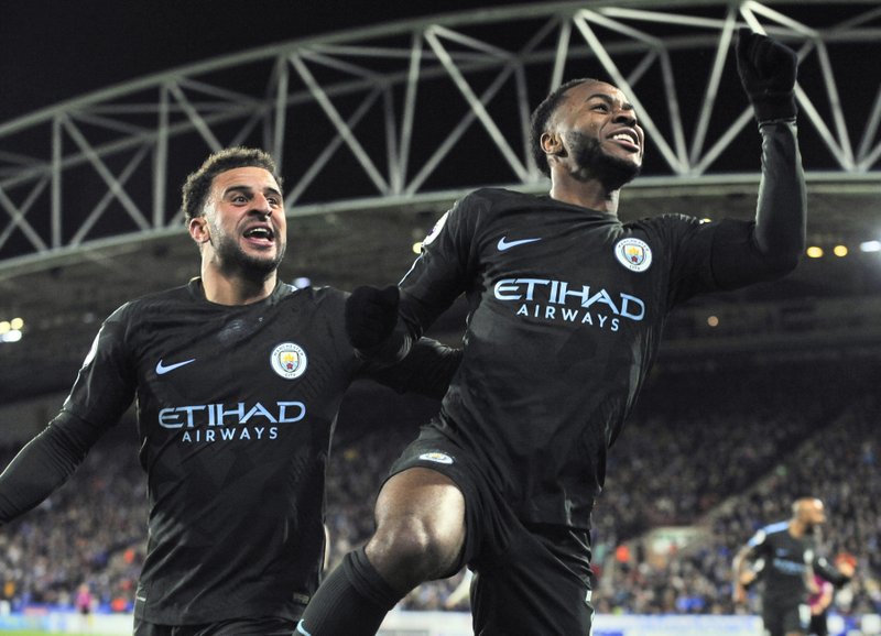 Sterling hits late goal as Man City sets EPL record; Arsenal 4th