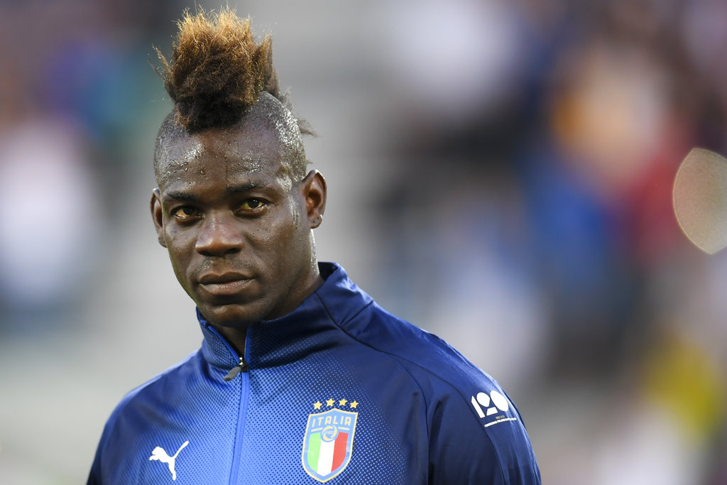 Balotelli praised for reacting to racist Italy fans' banner