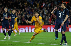 Barcelona's Luis Suarez celebrates after scoring his sides second goal during a Champions League quarter-final, first leg soccer match between FC Barcelona and Atletico Madrid at the Camp Nou stadium in Barcelona, Spain, Tuesday April 5, 2016. (AP Photo/Emilio Morenatti)