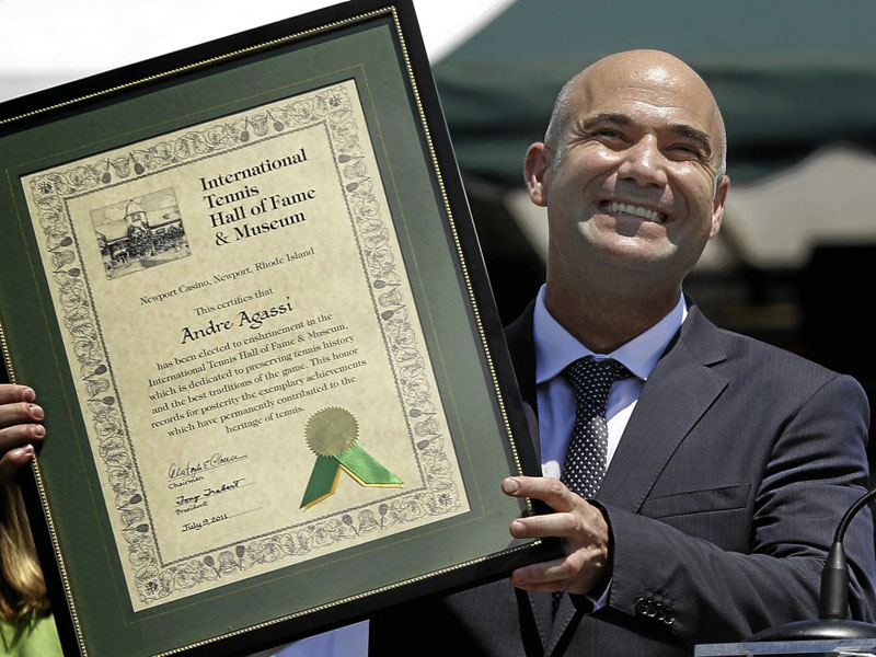 HALL OF FAMER Tennis great Andre Agassi holds his plaque as he is inducted to the International Tennis Hall of Fame, Saturday. AP