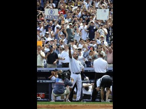 New York Yankees Derek Jeter waves to the cheers of the crowd after he hit a solo home run, his 3, 000th career hit,  in the third inning of a baseball game on Saturday, at Yankee Stadium AP Photo/Kathy Kmonicek.